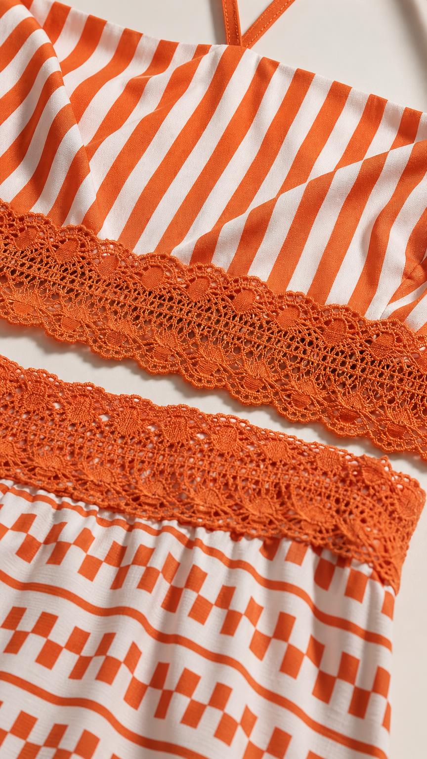 Close-up detail of orange top and skirt pattern with lace trim