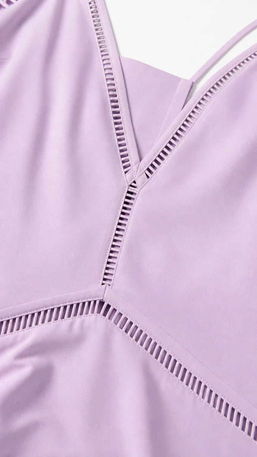 Close-up detail of V-neckline and ladder cutout trim