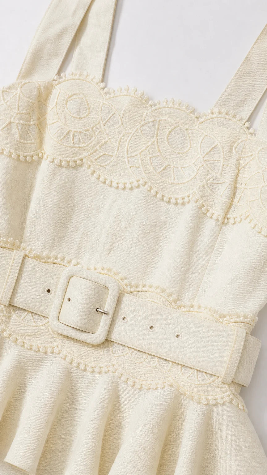Close-up detail of square neckline and matching belt on yellow dress