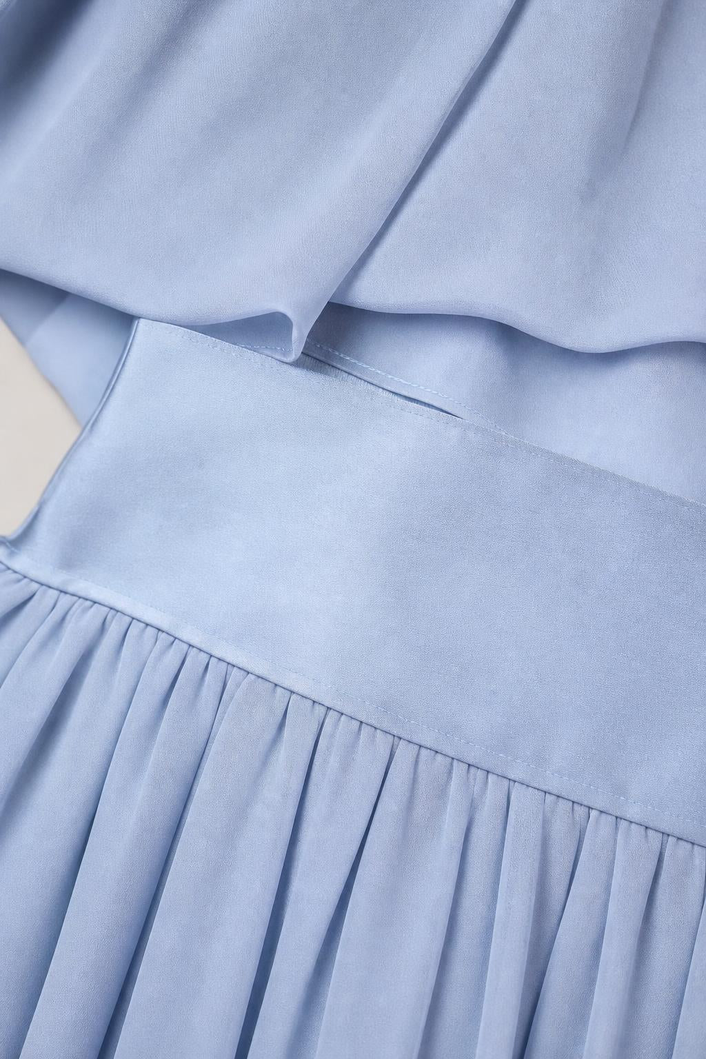 Close up of light blue fabric texture and waistband