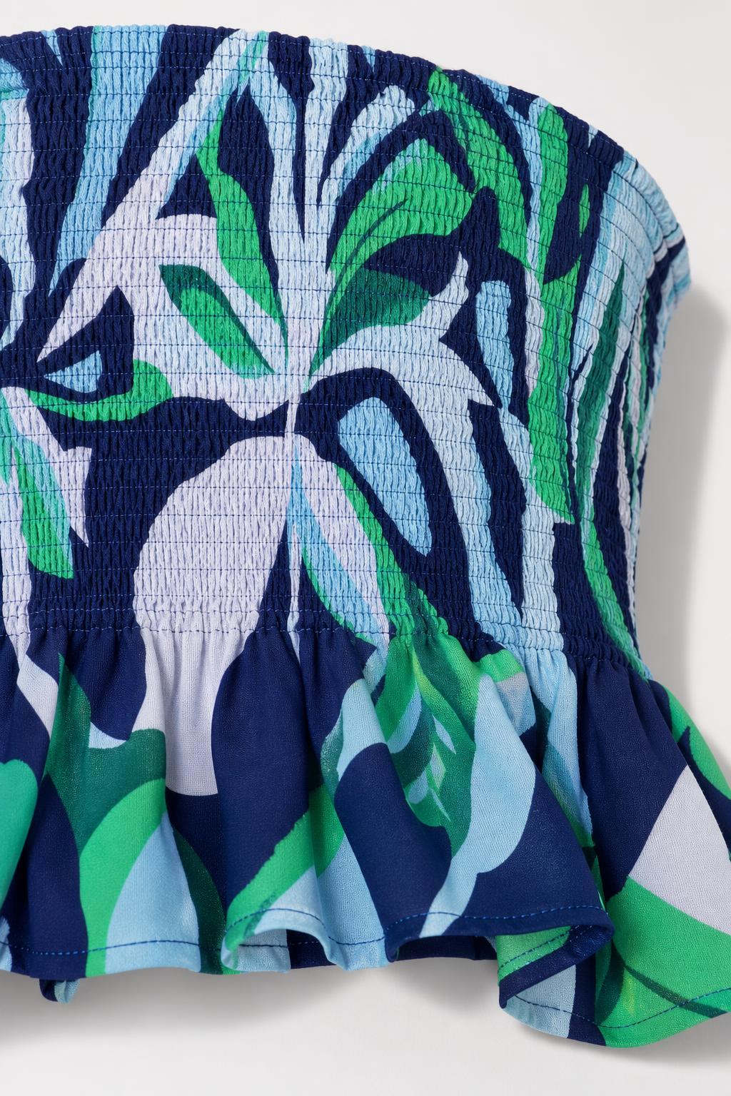 Close-up detail of smocked bandeau top texture and print