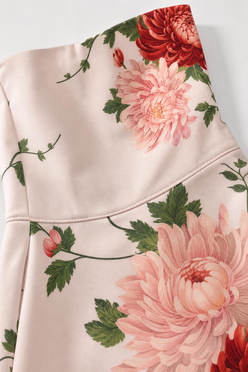 Close up of pink floral fabric print and seam details