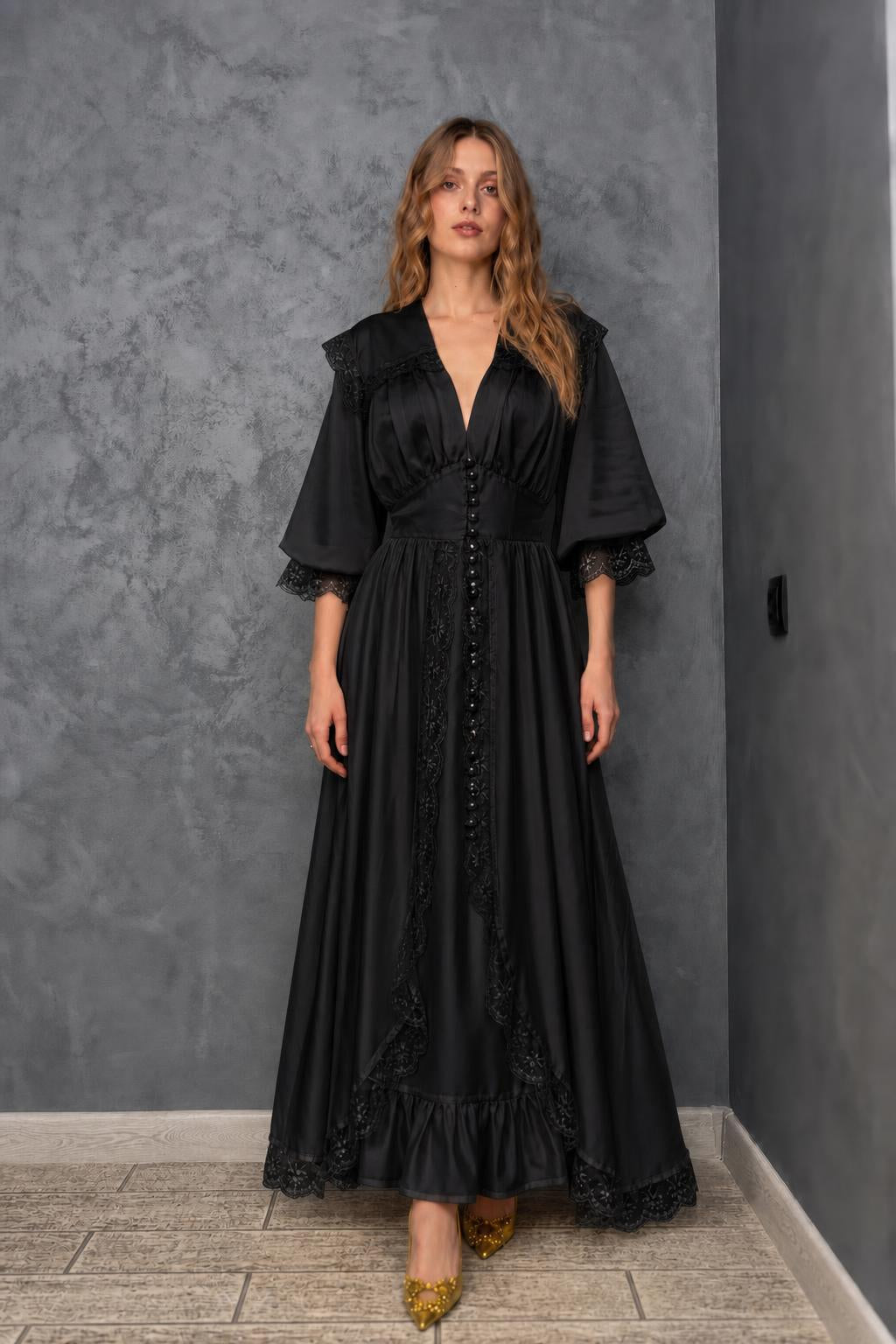 Model wearing black vintage lace maxi dress
