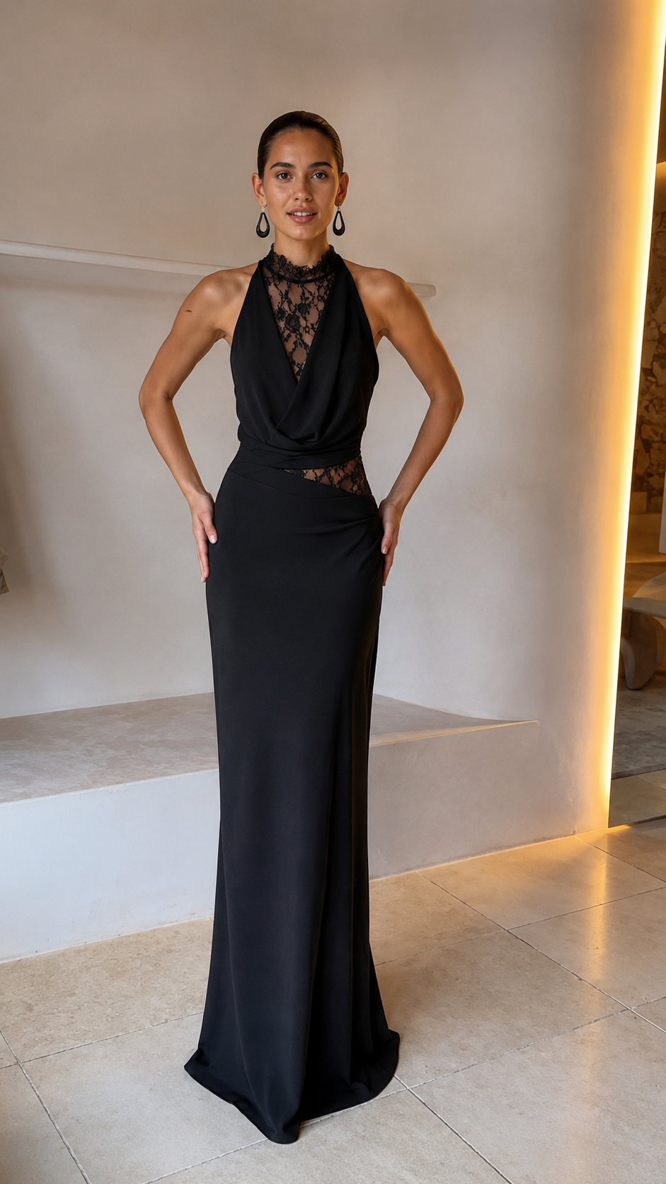 Front view of black halter lace evening gown with cowl neckline and fitted long skirt