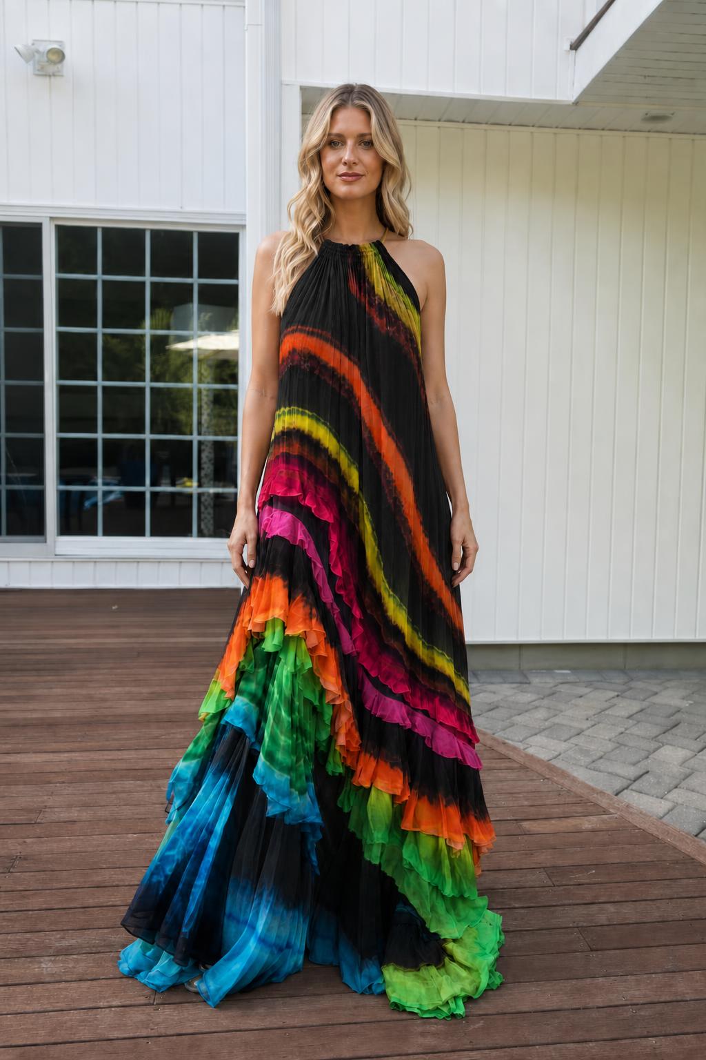 Model wearing black base rainbow gradient tiered maxi dress
