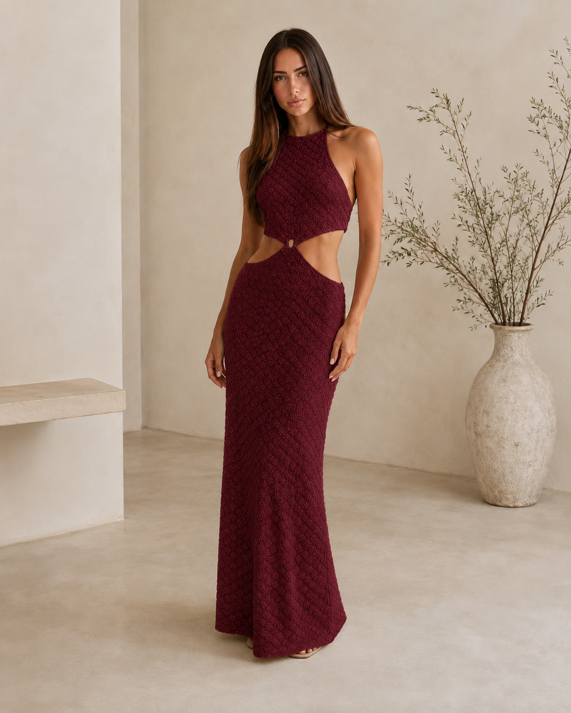 Front view of burgundy textured halter cutout maxi dress