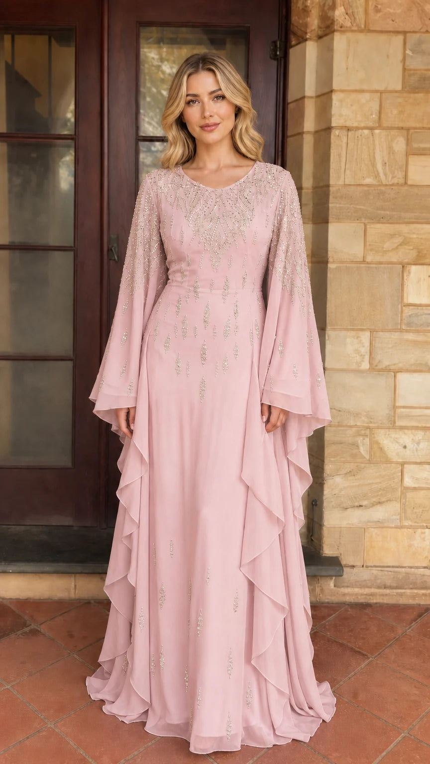 Model wearing pink beaded long sleeve maxi dress