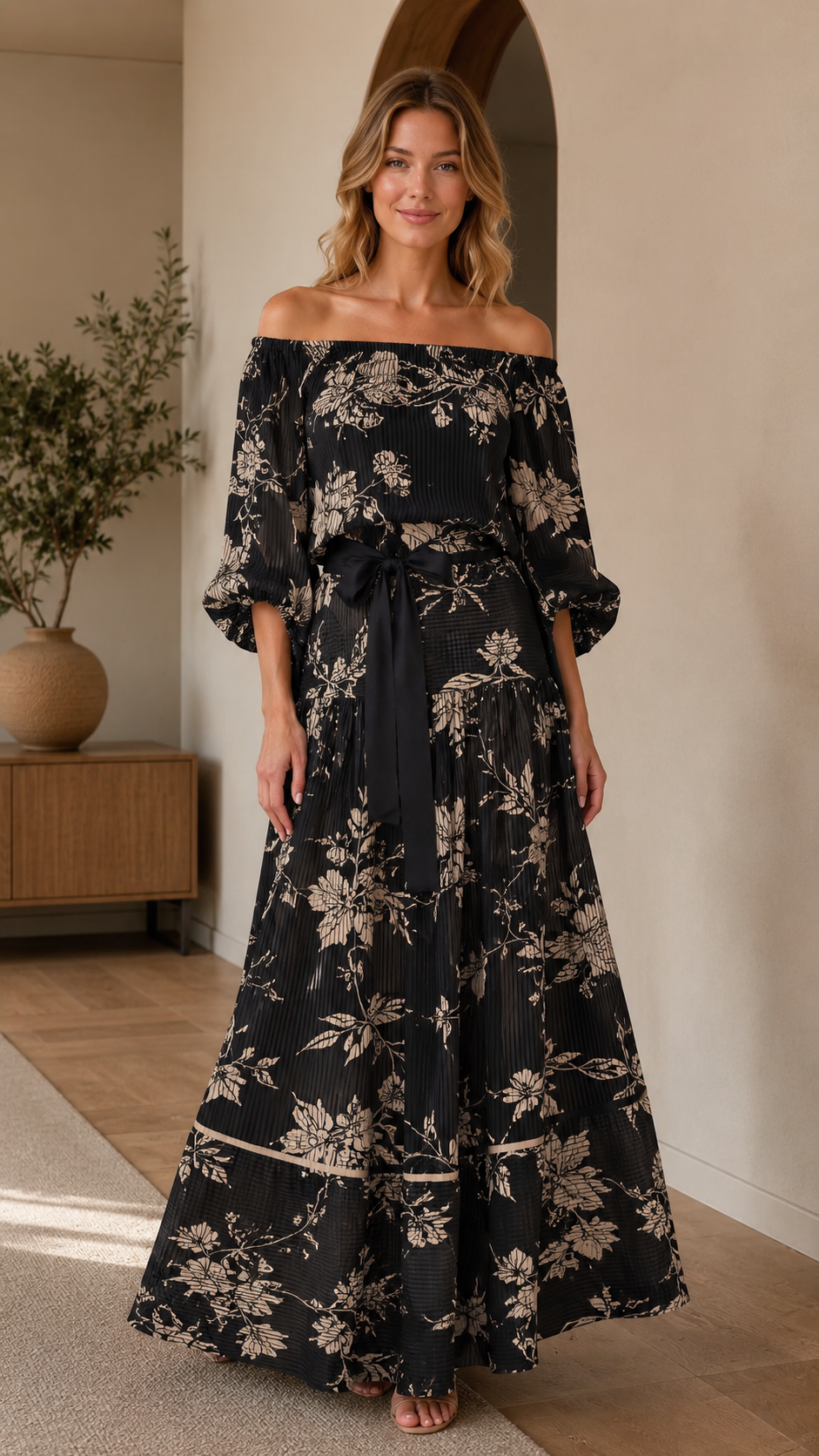 Black off-shoulder floral maxi dress with puff sleeves and flowing tiered skirt