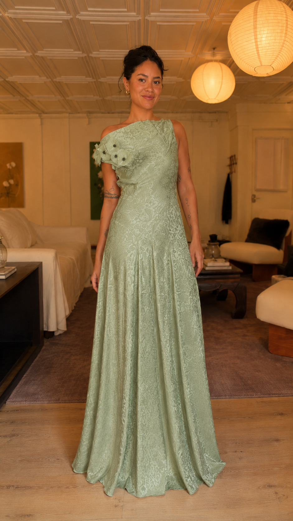 Front view of sage green one-shoulder floral appliqué gown