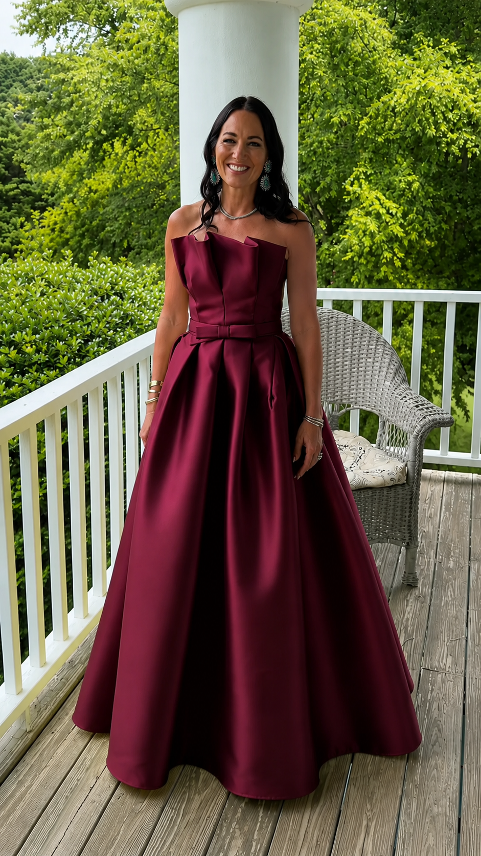 Front view of burgundy strapless A-line maxi gown with full skirt