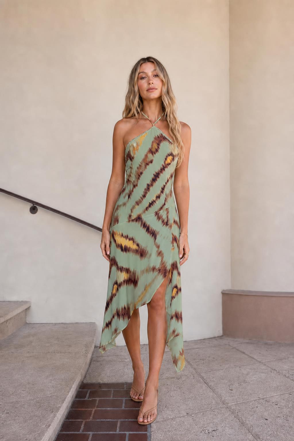 Front view of green printed halter midi dress