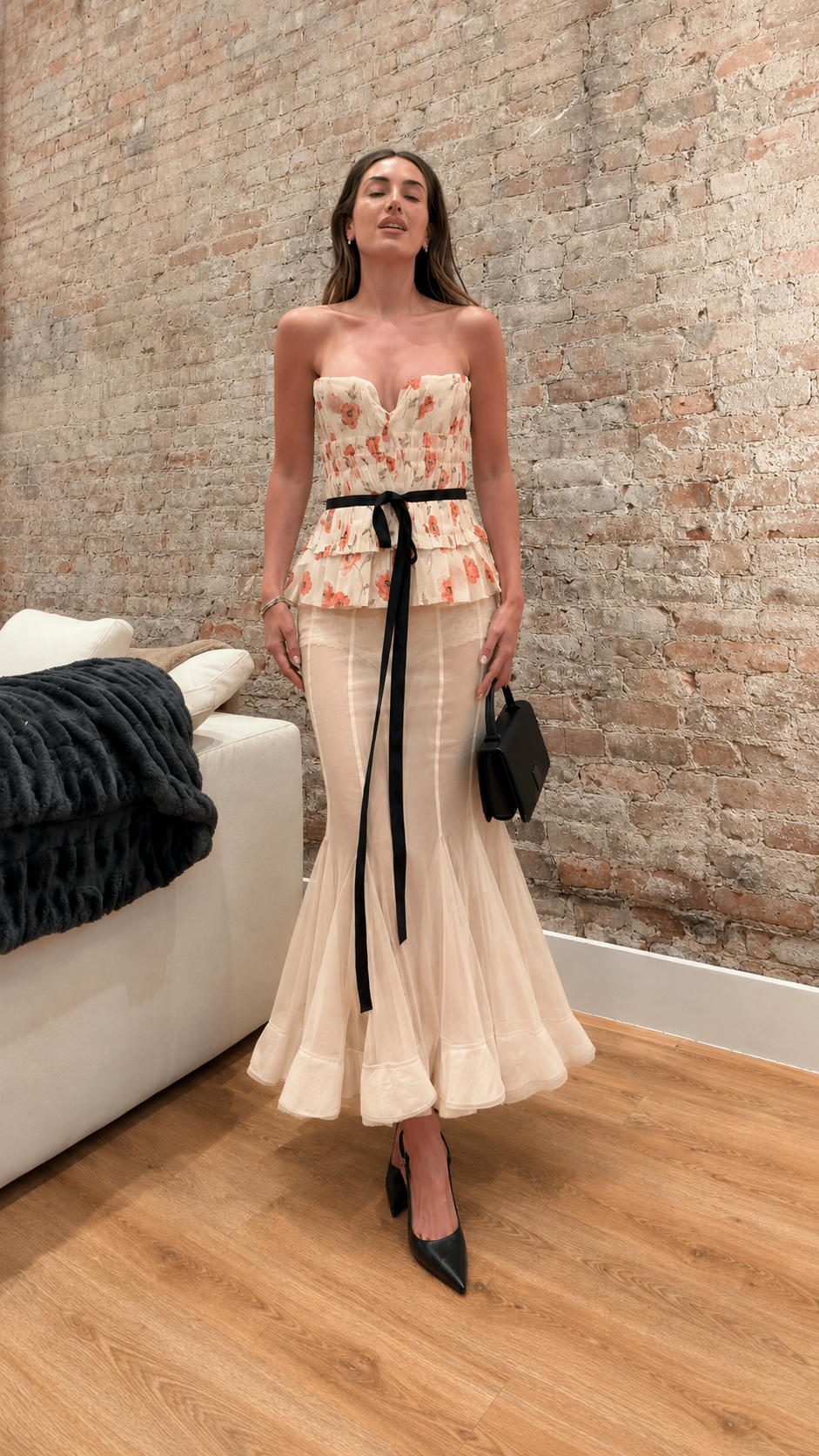 Front view of champagne strapless floral peplum mermaid maxi dress