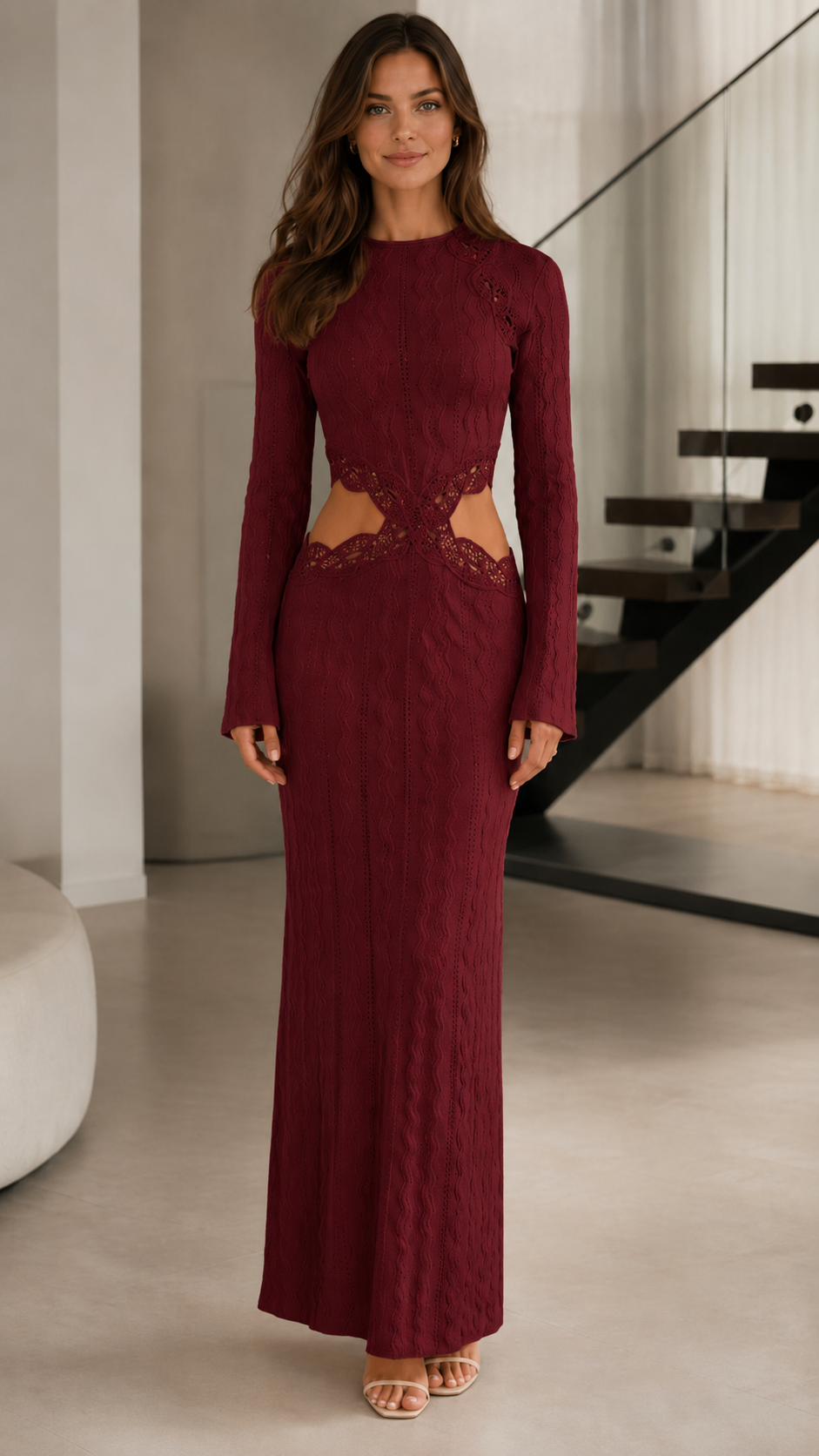 Front view of burgundy long sleeve textured maxi dress with lace-trim waist cutouts