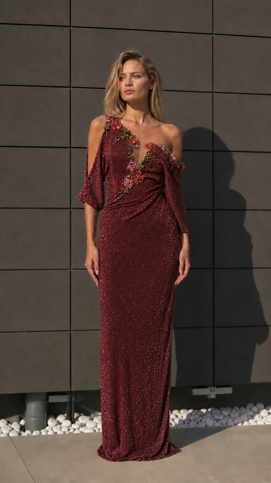 Front view of burgundy one-shoulder beaded evening dress