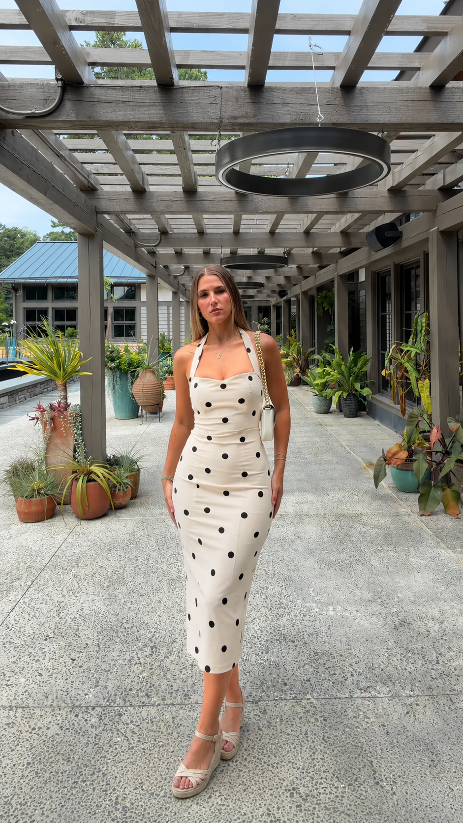 Front view of ivory polka dot bodycon midi dress