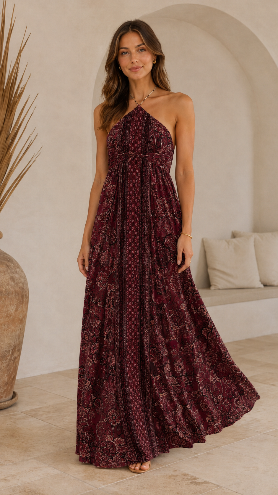 Front view of burgundy halter maxi dress with mixed print and full skirt