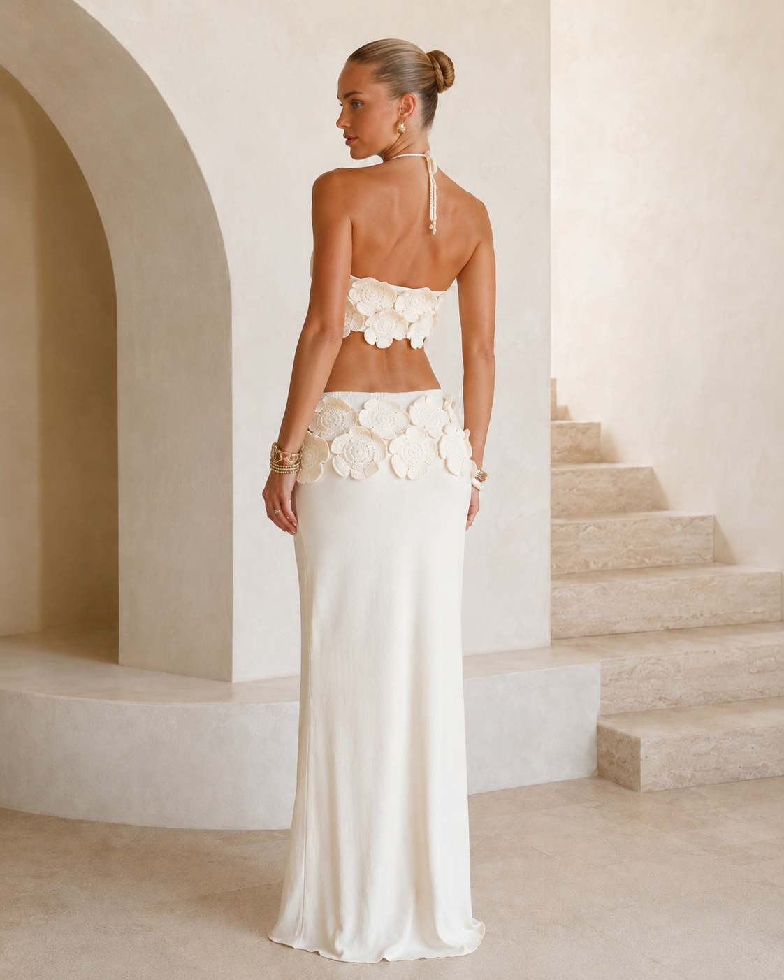 Back view of ivory floral halter crop top and matching maxi skirt set